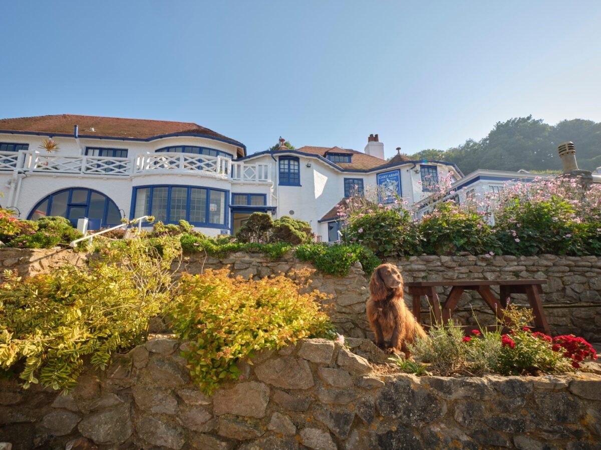 Hotel exterior and lower terrace at Cary Arms and Spa, Babbacombe Beach, Devon.