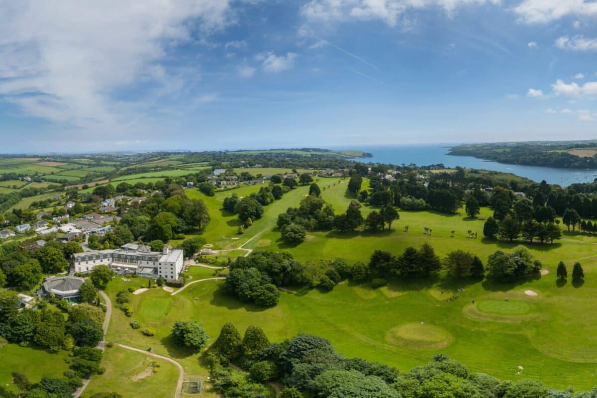 A bird's-eye view of Budock Vean Hotel & Spa and the surrounding Cornish coastline