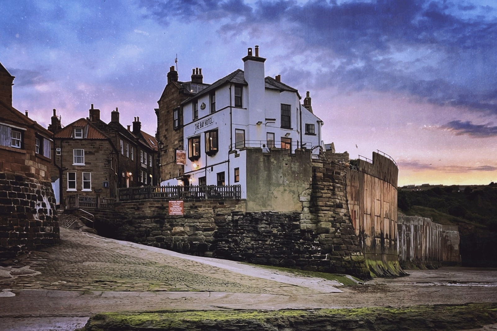 Sunset over Robin Hood’s Bay harbour, a popular dog-friendly spot in North Yorkshire