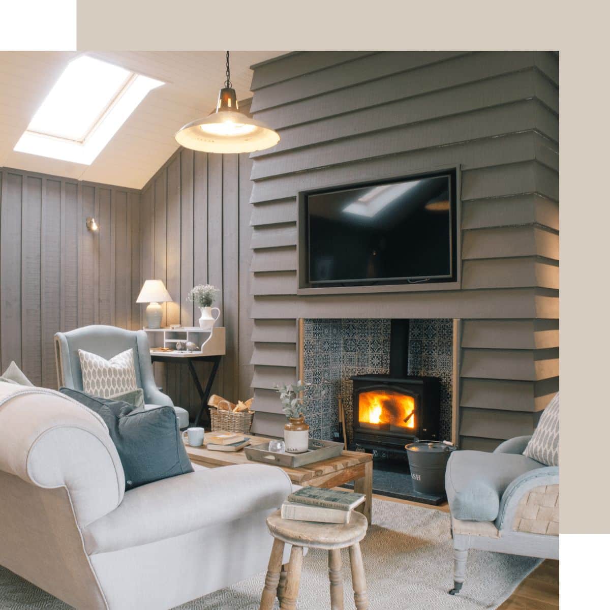Cozy living room at Retreat East with fireplace and television